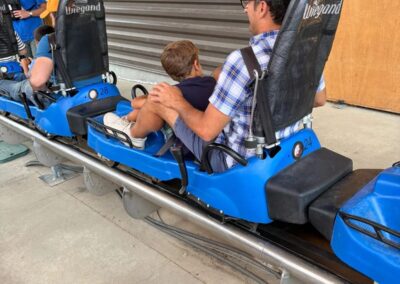 Father and son riding the Glade Runner mountain coaster at Bogus Basin